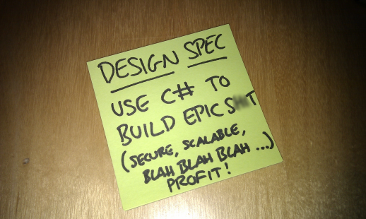 A post-it note reading "Design spec = Use C# to build epic s**t (secure, scalable, blah, blah...profit!)"